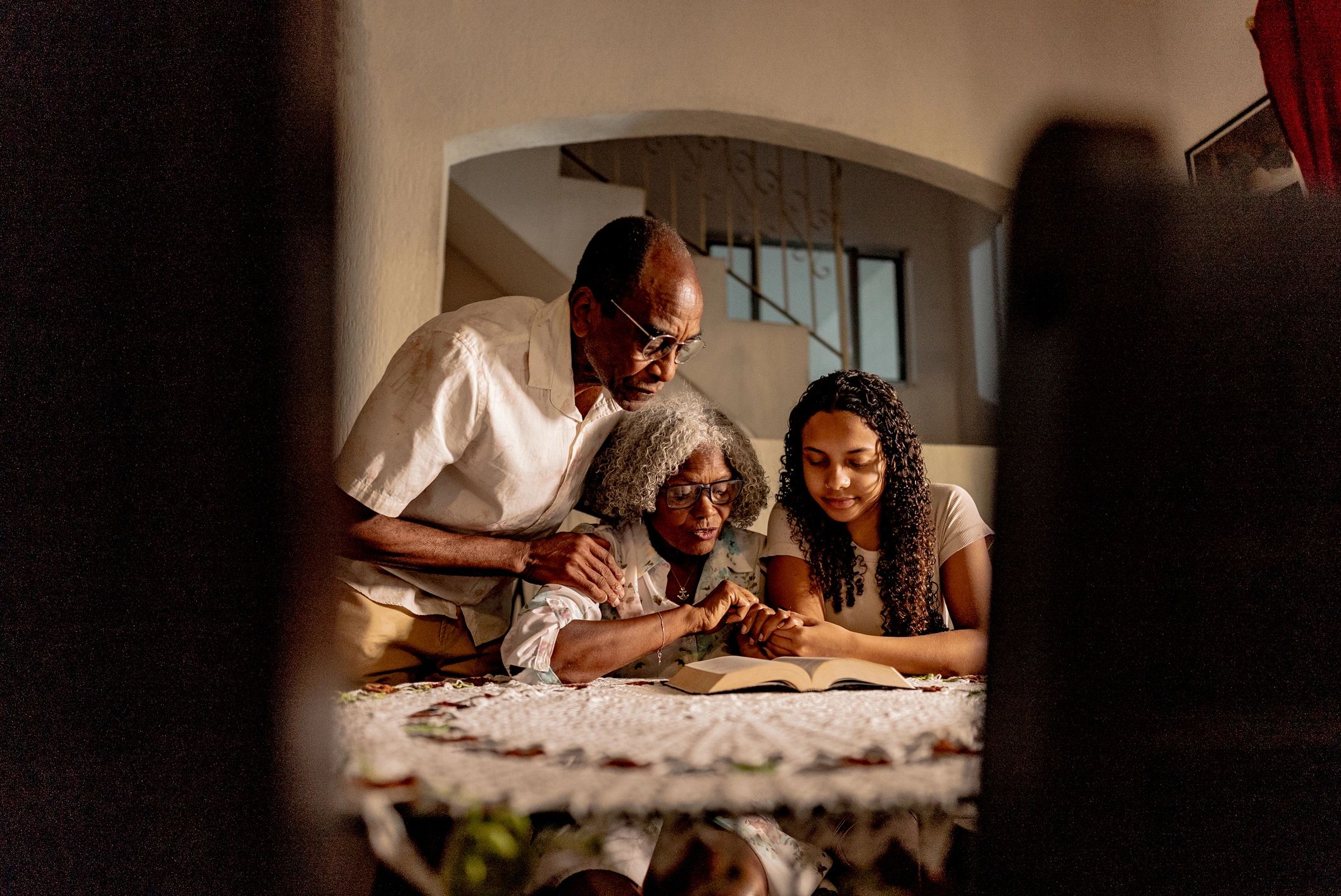 Family reading the Bible together