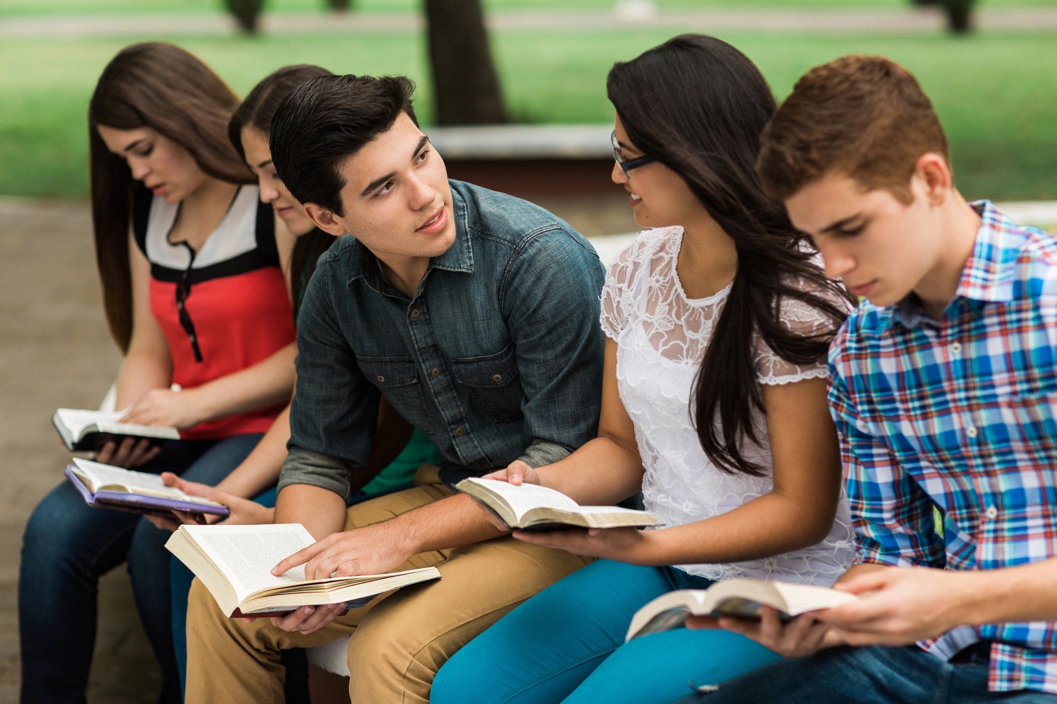 Individual participating in a study discussion